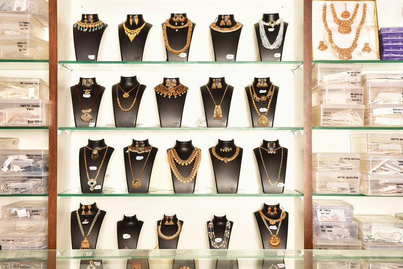 Temple and kemp necklace sets on display at S M Stores — Avalna, Arcot Tamil Nadu